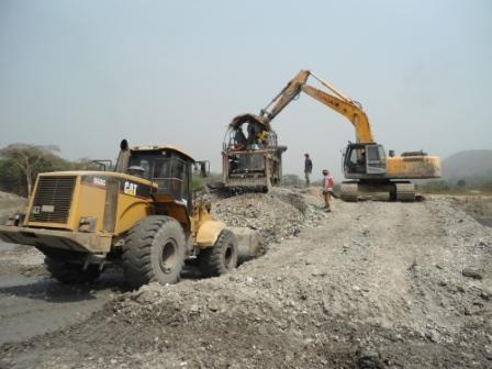 CAT wheel loader and excavator handling mineralized gravel at a MOUHDJAF gold operation