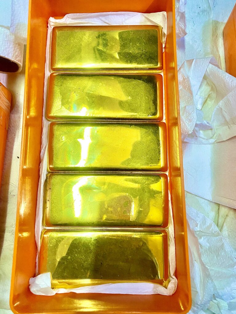 Freshly cast 24-karat MOUHDJAF gold bars